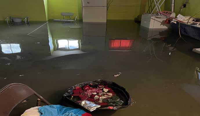 A flooded basement has water covering the floor